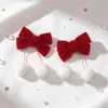 Presilha de cabelo com laço de pompom vermelho flocado de Natal transfronteiriça, presilha de cabelo e acessório de cabelo festivo de Ano Novo para crianças