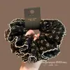 Nudo de Pelo Nuevo Otoño 2025 con Borde de Encaje Negro Estampado para Mujer con Estilo Francés, Nudo de Pelo de Alta Gama en la Parte Posterior de la Cabeza