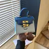 Otoño 2026 Nuevo Mini Bolso Kelly Estilo Padre-Hijo para Niños Bolso de Mano Cruzado Bolso de Mano de Dibujos Animados Texturizado Bolso de Hombro