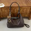 Tendência minimalista transfronteiriça outono 2026 nova moda bolsa de trabalho feminina casual personalizada bolsa de ombro transversal