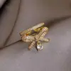 Anel de laço em ouro 18K banhado com micro cravação de zircônia design aberto ajustável anel de casal anel pingente