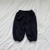 Pantalones deportivos casuales unisex con estampado de estrellas, ropa infantil estilo coreano, diseño versátil, colección otoño 2026, pantalones de moda a la altura del tobillo para niños pequeños y mayores