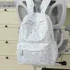 Mochila da moda estilo coreano com estampa de estrelas, uma opção estilosa e de alta qualidade para alunos do ensino fundamental e médio, oferecendo grande capacidade para o uso diário.