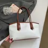 Bolso de Hombro Versátil Tejido 2026 Nuevo Verano Bolso Cubo de Gran Capacidad Estilo Coreano Bolso de Cesta de Paja Bolso de Mujer