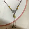 Collar con colgante de campana de mariposa de cerámica de estilo étnico retro para mujer, diseño nuevo y moderno, cadena larga para suéter, accesorios