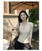 Top de punto estilo retro con mangas abullonadas, botones de perla multicolor, nueva camiseta base fina de verano con cuello en V, adelgazante para mujer