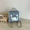Diseñado para el invierno, este bolso de mano/hombro casual para mujer, estilo vintage 2026, de gran capacidad, moda retro, con bloques de color, es un bolso cuadrado pequeño.