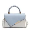 Moda textura cor combinação nova 2025 cor contrastante primavera casual simples estilo estrangeiro bolsa transversal pequena quadrada para mulheres