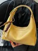 Bolso de hombro minimalista de alta costura transfronterizo 2026 nuevo y moderno tipo bolsa de albóndigas para mujer, elegante bolso de hombro, bolso cruzado casual