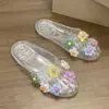 Zapatos de Gel de Moda Decorados con Flores de Dopamina para Mujer Verano 2026 Nuevo Estilo Coreano Sandalias Planas Transparentes Dulces de Cristal