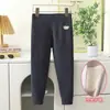 Nuevos pantalones térmicos protectores de rodilla para niños de otoño e invierno para niños y niñas, leggings engrosados con calefacción de cintura alta, pantalones esenciales para uniforme escolar para niños