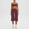 Nuevo conjunto de yoga cruzado con cuello halter y hermoso diseño en la espalda, pantalones casuales de tres cuartos de cintura alta y secado rápido, y un conjunto de ropa para correr/yoga al aire libre