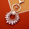 Llavero de coche de girasol de perla con incrustaciones de diamantes, flor de cristal, lindo colgante para bolso de mujer, llavero con anillo, regalo transfronterizo