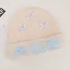 Gorro de alta calidad de mezcla de lana coreana, perfecto para otoño e invierno, hace que tu cara se vea más pequeña, presenta un patrón de jacquard con letras y tiene un ajuste holgado y cómodo