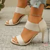 Sandalias de tacón alto con tira elástica estilo europeo y americano, sandalias de punta cuadrada con tacón de aguja y punta abierta, zapatos de moda transfronterizos versátiles y elegantes para mujer