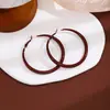 Pendientes Ancola Corazón Rojo con Lazo para Otoño e Invierno, Realzan el Cutis y Hacen que el Rostro Parezca Más Pequeño, Lujo Ligero con un Toque de Alta Gama, Pendientes de Estilo Año Nuevo