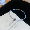 [Cadena de Diamantes Arcoíris] Pulsera de extracción de zircón trenzado en cruz, una pulsera lujosa y de alta gama, una pieza de joyería delicada y de moda