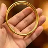 Pulsera de Empuje y Tirón de Seda Trenzada Doble Artesanal Tradicional para Mujer, Color Dorado Imitación, Doble Anillo, "Alegría de Dos Mundos", Brazalete Sólido Liso