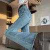 Micro-jeans azul claro para mujer 2024 invierno nuevo cintura alta con pelo pantalones de campana hasta el suelo