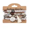 Venta Caliente Europea y Americana Nuevo Estilo Bohemio Creativo Multicapa Imitación Bodhi Pulsera de Perlas Aleación Alas Borla Pulsera