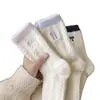 Calcetines gruesos cálidos antideslizantes resistentes al desgaste de media pantorrilla calcetines de felpa otoño e invierno para el hogar casual calcetines de pareja estilo moderno