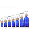 Botella de vidrio para aceites esenciales con anillo de madera de bambú y gotero, botella azul a prueba de luz para aceites esenciales, botella vacía de 10 ml 30 ml para aceites esenciales, gama alta