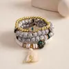 Juego de cuatro pulseras de acrílico con cuentas y diamantes incrustados de estilo europeo y americano, con un diseño único, retro y exagerado, perfecto para ventas transfronterizas