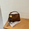 Bolso de mano retro de nicho Shuai Mijia 2026 otoño nuevo bolso de hombro cruzado para el trabajo bolso tipo almohada de gran capacidad