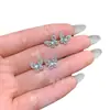 Suministro directo al por mayor de fábrica aretes de jadeíta mariposa azul de material natural peligroso diseño pequeño y fresco con incrustaciones de plata s925