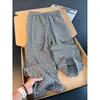Pantalones jacquard de estilo retro americano con estampado oscuro, colección de verano para hombre, con un diseño fluido de alta gama, corte recto y un ajuste relajado y holgado para uso casual.