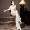 Un Conjunto Completo de Verano para Mujer en un Estilo Clásico 'Old Money', con un Conjunto de Dos Piezas de Top de Manga Corta y Pantalones de Pierna Ancha