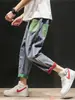 Jeans rasgados de moda para hombre con cintura elástica y cordón, corte recto holgado, estilo callejero americano, bolsillos de color en bloque geniales