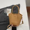 Bolsa tote estilo balde, simples e casual para mulheres, nova coleção primavera 2026, moderna e estilosa, com uma textura única, pode ser usada como bolsa de ombro ou bolsa transversal