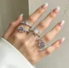 Anillo Cruzado Europeo y Americano con Gema Morada para Mujer, Anillo de Lujo Ligero de Alta Gama Incrustado con Diamantes de Sol y Luna
