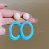 Pendientes de borlas de flores coloridas súper de cuento de hadas, pendientes de botón y argollas dulces de nicho de alta gama, pendientes exagerados estilo vacacional
