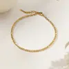 Tobillera de Acero de Titanio y Oro de 18 Quilates para Mujer, Cadena para el Pie de Nuevo Estilo Otoño/Primavera Transfronterizo, Lujo Ligero Nicho, Alta Gama para Chicas, No se Desvanece, Venta al por Mayor