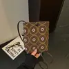 Bolsa transversal versátil retrô para mulheres, novidade outono 2026, casual, nicho, poá, mini bolsa requintada para celular