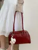 Item Quente com Relevo de Cruz Bolsa de Axila Feminina 2026 Nova Nicho Alta Aparência Bolsa de Ombro Único Versátil Toque de Luxo Bowling