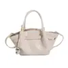Nova bolsa tote de moda transfronteiriça retrô simples de grande capacidade com design em relevo trançado, bolsa de ombro e bolsa de mão feminina para o dia a dia