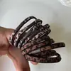 Faixa de Cabelo Leopardado Cor Pura Coreana para Mulheres Elástico Alta Elasticidade e Durável Corda de Cabelo Simples Novo Elástico de Cabelo Acessórios de Cabeça Versáteis