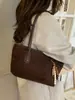 Nueva colección de primavera 2026: Bolso de mano para mujer estilo coreano, con un elegante diseño color block, gran capacidad y correa para el hombro, lo que lo convierte en un bolso tote versátil para ventas transfronterizas.