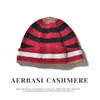 Venta al por mayor de fábrica Cachemira Transfronterizo Otoño/Invierno Nuevo Engrosado Bloque de Color Rayas Dobladillo Cálido Tejido Protección para Orejas Gorro para la Cabeza