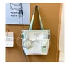 Bolsa de mano fresca estilo japonés al por mayor para mujer, nueva bolsa de hombro color block de nailon 2026, bolsa cruzada y bolso de mano