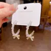 Aguja de Plata S925 Lujo Ligero Nicho Sentido de Alta Gama Estilo Frío Sexual Elegante Anillo Pendientes Moda Versátil Elegante Pendientes de Flor