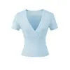 Ropa de Mujer al por Mayor Transfronteriza Estilo Europeo y Americano 2026 Primavera Nueva Elegante Ajustada de Línea Dividida Cuello Cruzado Camiseta de Manga Corta
