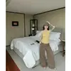 IA # Camisola feminina verão 2026 novo estilo americana sexy garota quente decote V profundo curta justa sem mangas