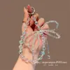 Llavero de Teléfono Corto con Pedrería de Gama Alta, Lazo Doble, Colgante de Botón Único de Moda, Accesorio Hecho a Mano con Cuentas de Cristal
