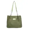 Bolso de pana de gran capacidad para mujer 2026 nueva moda simple texturizado asequible hombro de mano para el día a día