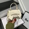 Elegante y moderna bolsa de nicho con lazo para mujer, nueva moda, bolso cruzado versátil, bolso de mano de color liso para salir