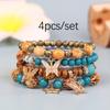 Exquisita Pulsera de Cuentas de Madera Europea y Americana Bohemia Borla Cuatro Colgantes de Mariposa Joyería Vacaciones Viajes Cuentas Hechas a Mano